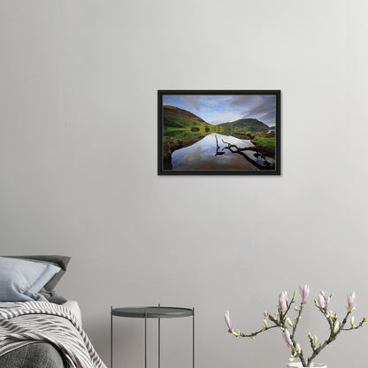 Solitary branch in foreground of Crummock Water framed canvas