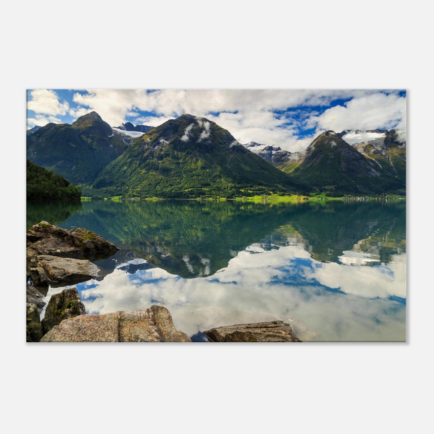 Majestic Norwegian lake scene with perfect mirror-like surface capturing lush green mountain slopes