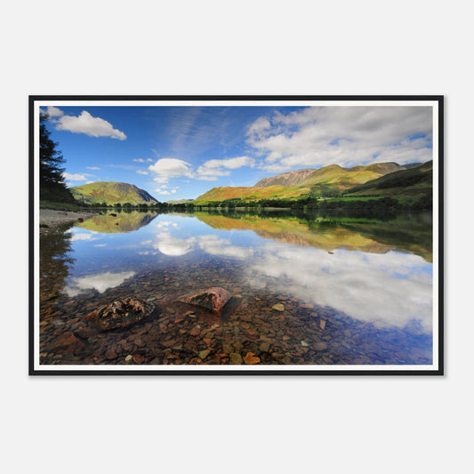 Crystal-clear waters at Buttermere revealing pebbled lakebed
