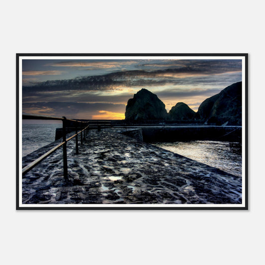 Wet slipway reflecting sunset light at Mullion Cove