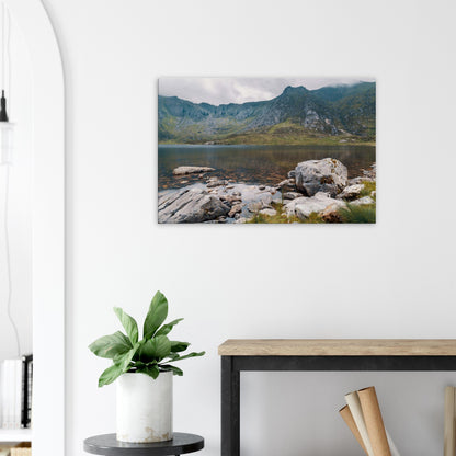 Serene Snowdonia lake view with rocky foreground canvas print