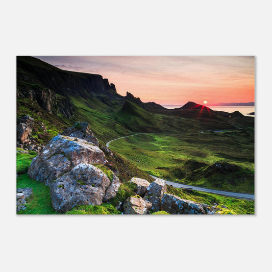 Canvas print featuring The Quiraing’s volcanic cliffs and winding valley road bathed in warm sunset light on the Isle of Skye.