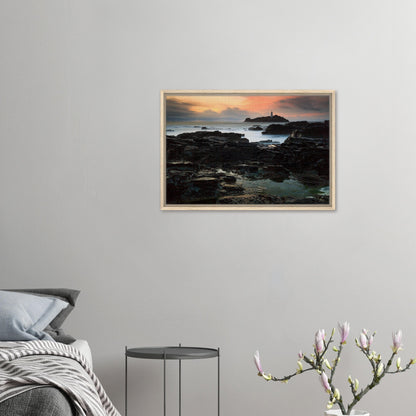 Lighthouse silhouetted against sunset sky in Cornwall canvas