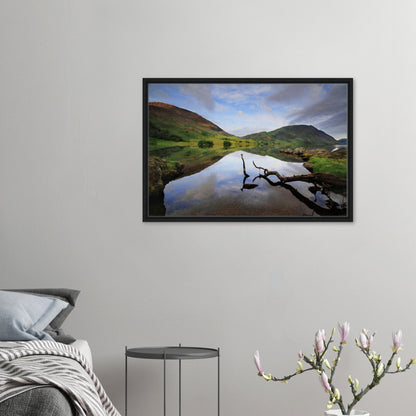 Framed canvas print of Crummock Water with branch reflection