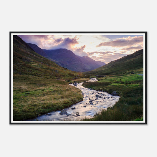 Golden light over rolling hills at Honister Pass framed wall art