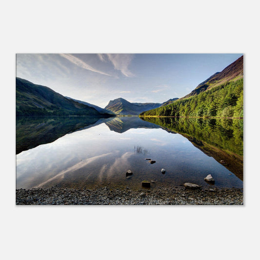 Peaceful landscape canvas of Buttermere with water like glass, reflecting rugged mountain scenery and soft sky light.