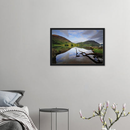 Reflective lake with soft sky and fells in framed wall art