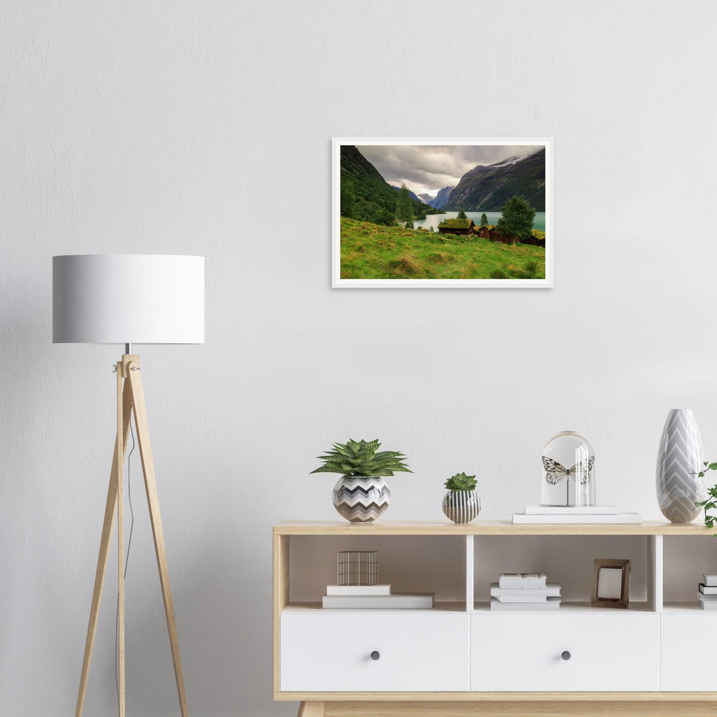 Grass-roofed cabins beside turquoise lake framed print Norway