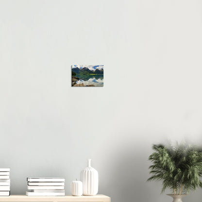 Serene canvas art depicting the harmony of sky, water, and rugged peaks in Norway’s wilderness