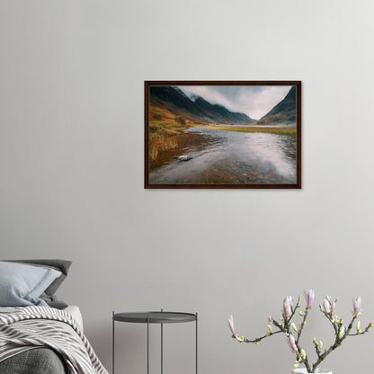 Tranquil Glencoe loch with misty peaks