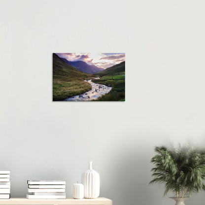 Canvas artwork capturing the peaceful golden hour atmosphere of Honister Pass with sunlit hills and distant misty mountains.