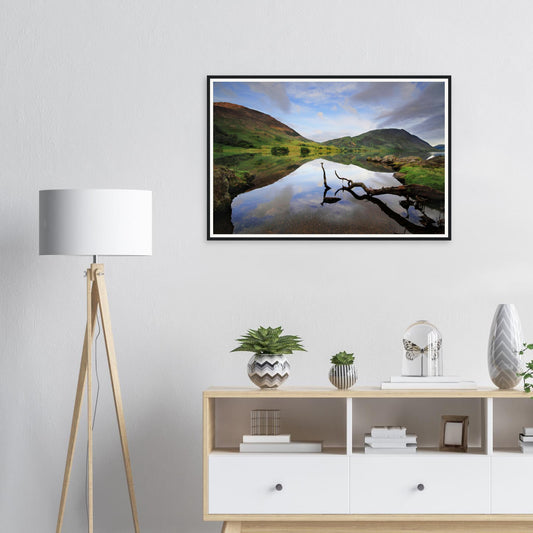 Framed print of Crummock Water in the Lake District with branch reflection