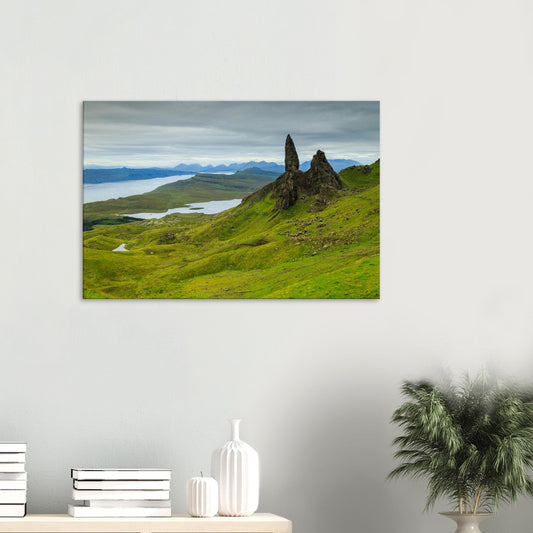 Canvas print of The Old Man of Storr on the Isle of Skye with dramatic rock pinnacles and lush green hills below.