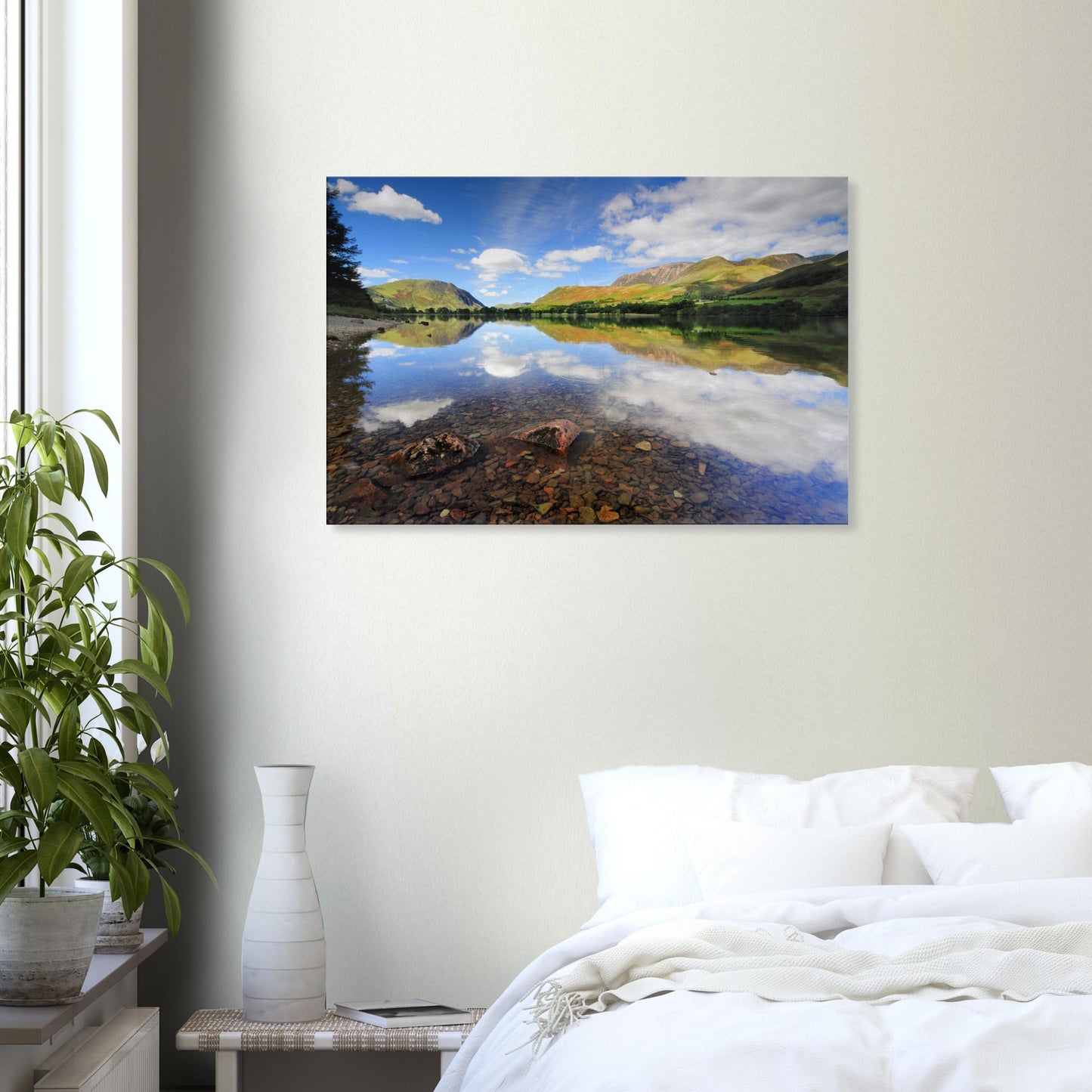 Reflective Lake District canvas showing Buttermere Lake’s calm surface, light-shadow play on the hills, and fluffy clouds above.