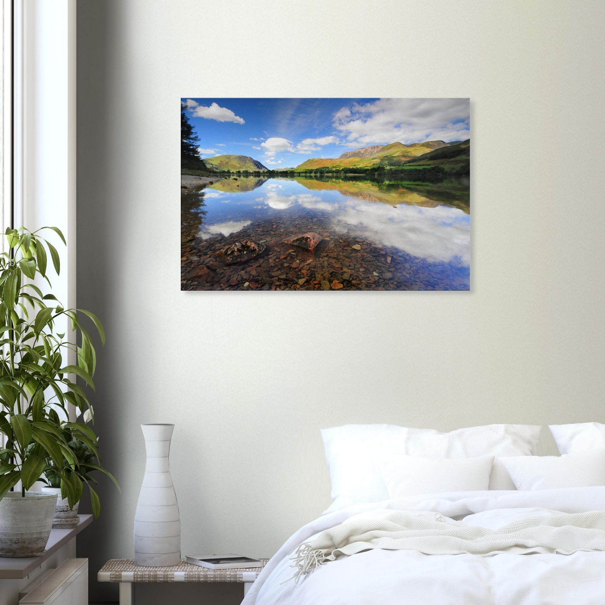 Reflective Lake District canvas showing Buttermere Lake’s calm surface, light-shadow play on the hills, and fluffy clouds above.