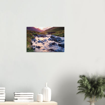 Canvas wall art capturing the calm beauty of Honister Pass during golden hour with a gently flowing stream and sturdy stone bridge.