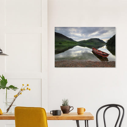 Red boat by reflective waters in the Lake District