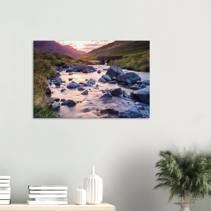 Canvas artwork of Honister Pass at dusk, highlighting a silky stream, scattered stones, and a historic stone bridge.