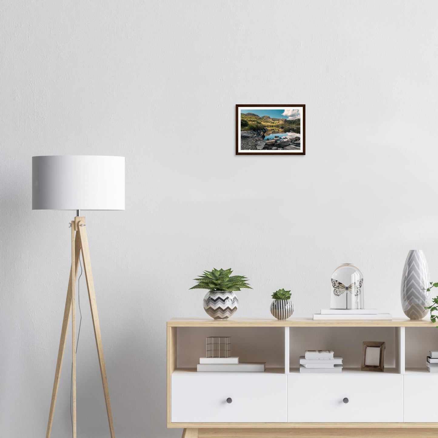 Rocks on shore of Llyn Llywelyn framed wall art Snowdonia