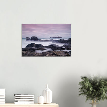 Godrevy Lighthouse canvas showcasing a dreamlike seascape with blurred waves, craggy rocks, and a serene, colourful sky.
