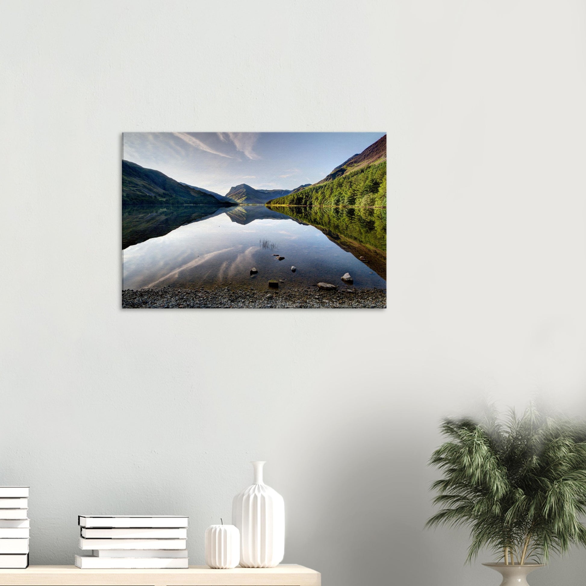 Reflective landscape canvas of Buttermere Lake with crisp reflections of fells and soft morning light highlighting rugged mountain peaks.