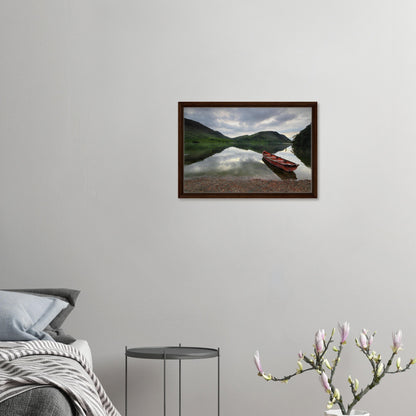 Red boat by Crummock Water in peaceful Lake District scene