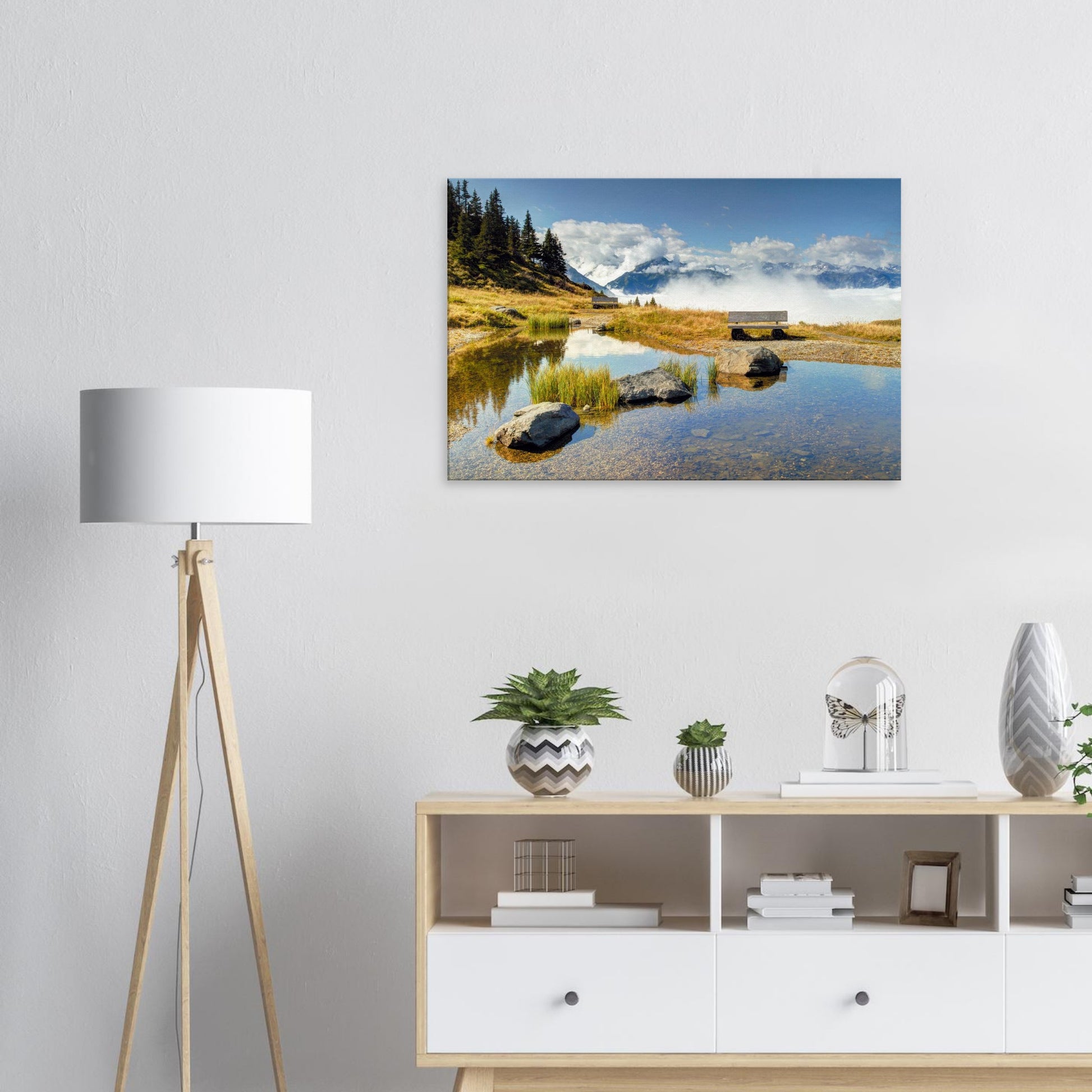 Austrian Alps wall art featuring a high-mountain bench overlooking a pond, with clouds rolling across the valley and peaks beyond.