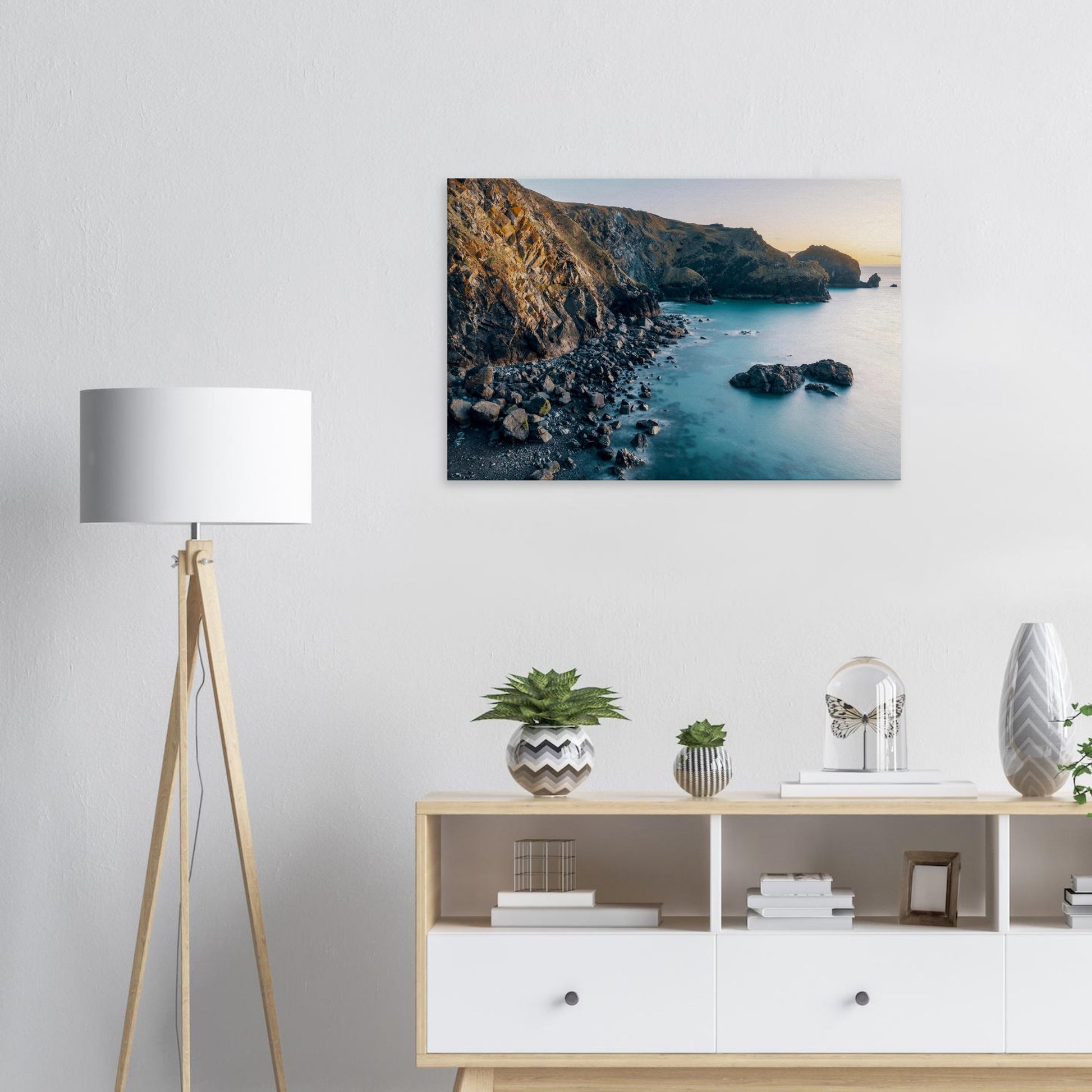 Picturesque Cornish seascape as sunset paints the sky and shoreline at Mullion Cove