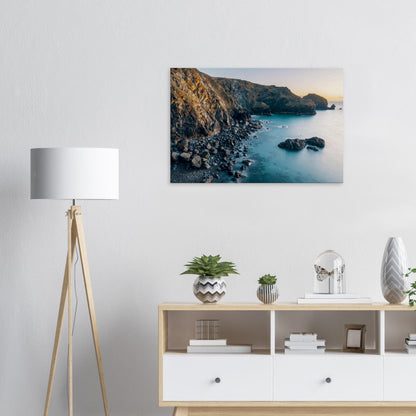 Picturesque Cornish seascape as sunset paints the sky and shoreline at Mullion Cove