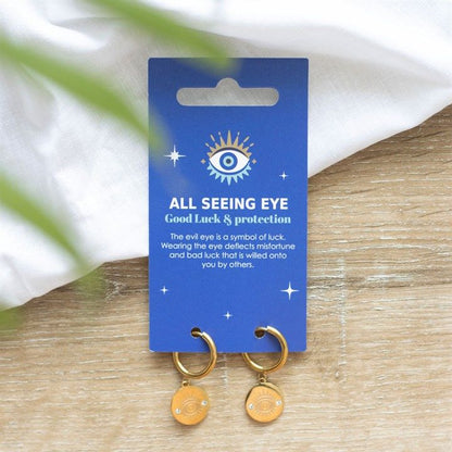 Gold-toned All Seeing Eye Earrings made from stainless steel, symbolising protection and good luck, presented on a printed meaning card.