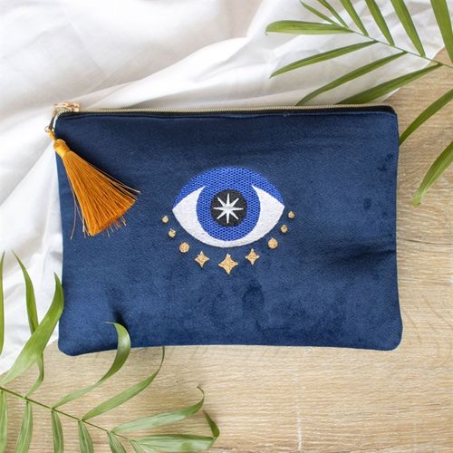 All Seeing Eye Makeup Bag featuring blue hues and metallic gold tassel, a talisman for good luck and protection.