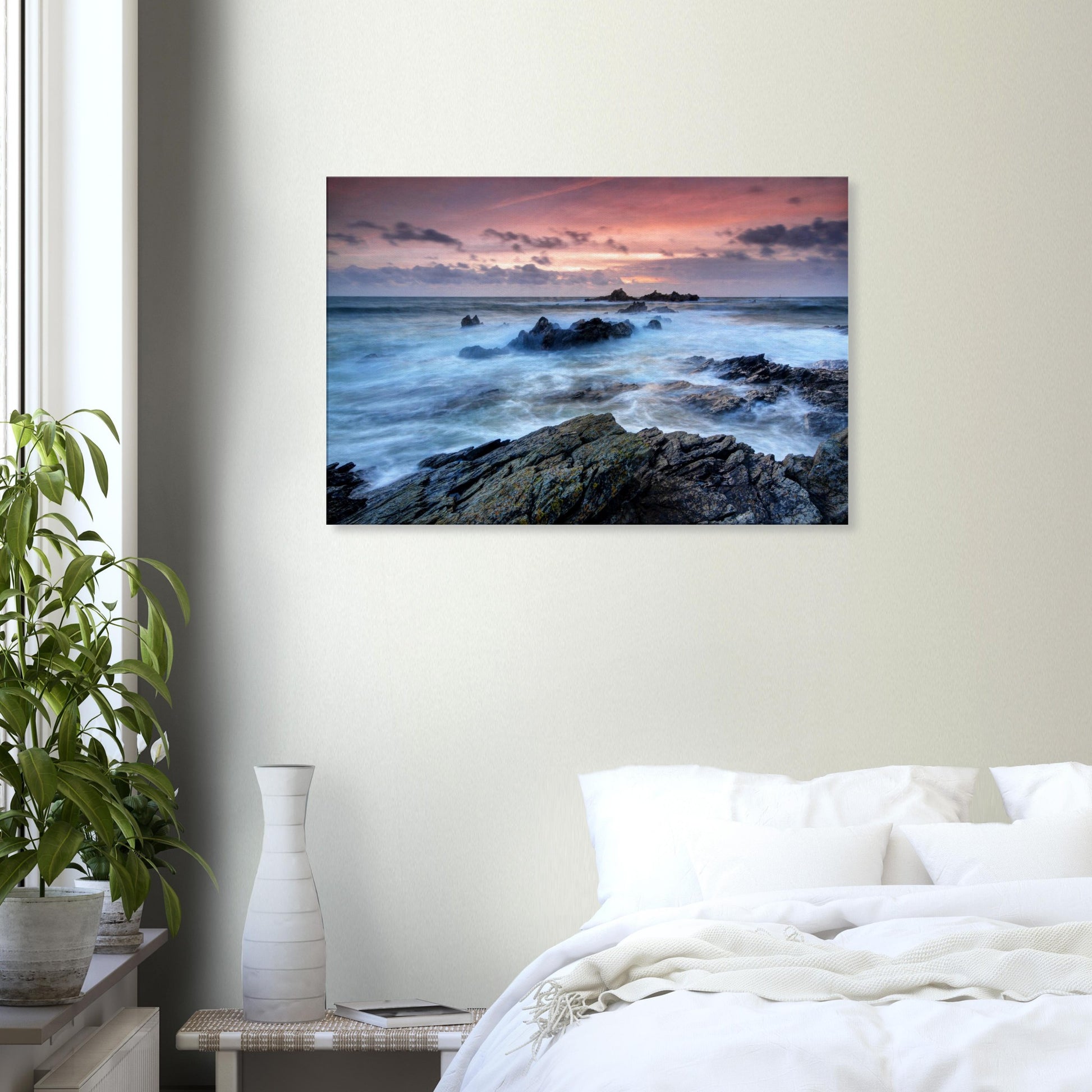 Canvas print capturing the dramatic energy of Heybrook Bay at sunset with swirling ocean waves, rocky coast, and a fiery red-orange sky.