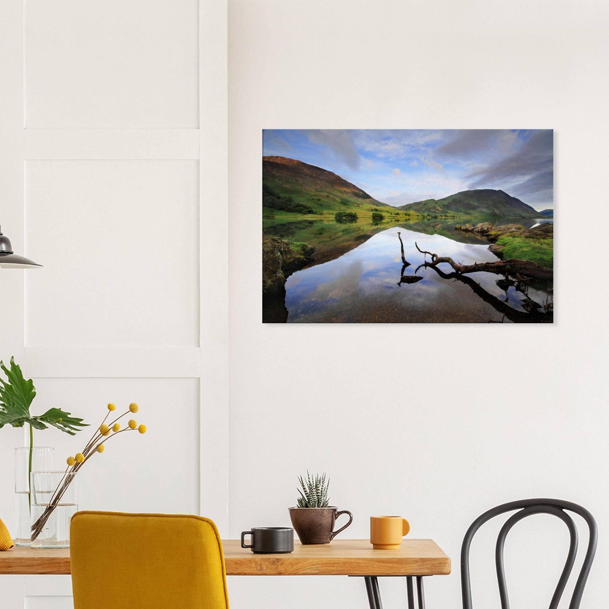 Peaceful landscape canvas of Crummock Water showing a branch floating near the shore and calm waters reflecting the gentle Lake District scenery.