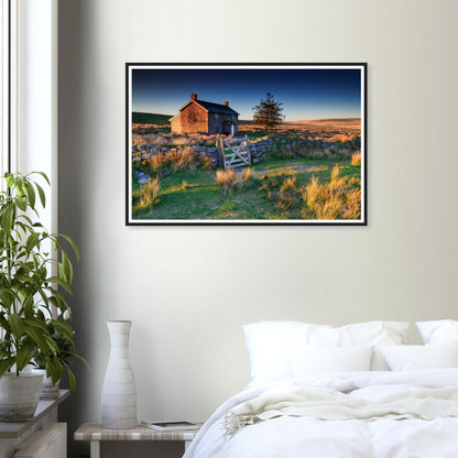 Sunrise glow across rugged moorland and farm framed print
