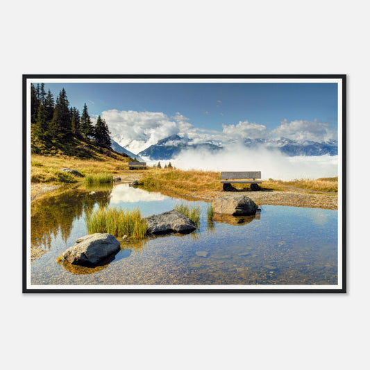 Tranquil pond reflecting sky at Resterhöhe in Austrian Alps
