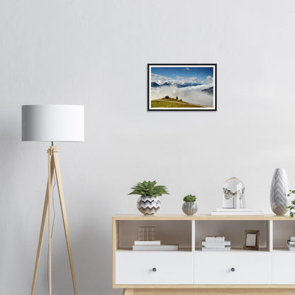 Verdant hilltop framed print in Austrian Alps above the clouds