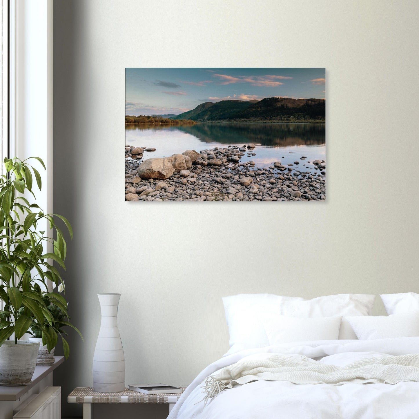 Bassenthwaite Lake shoreline with stones in foreground and calm reflections