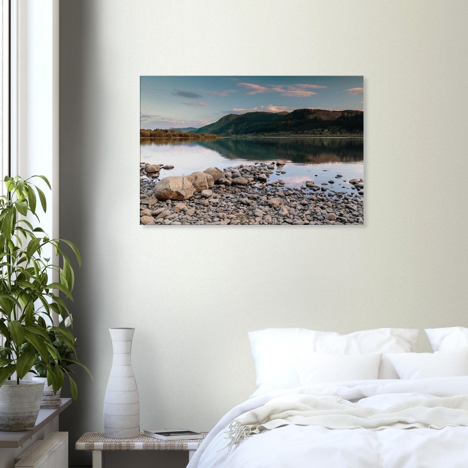 Bassenthwaite Lake shoreline with stones in foreground and calm reflections