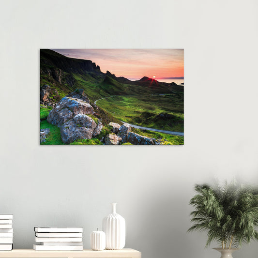 Canvas print of The Quiraing on the Isle of Skye at sunset with vibrant pink and orange sky over rugged cliffs and winding road.