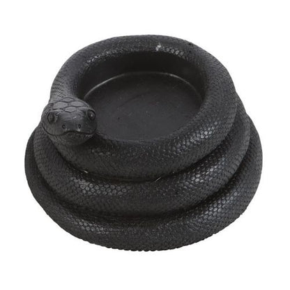 Black coiled snake tealight holder casting eerie shadows