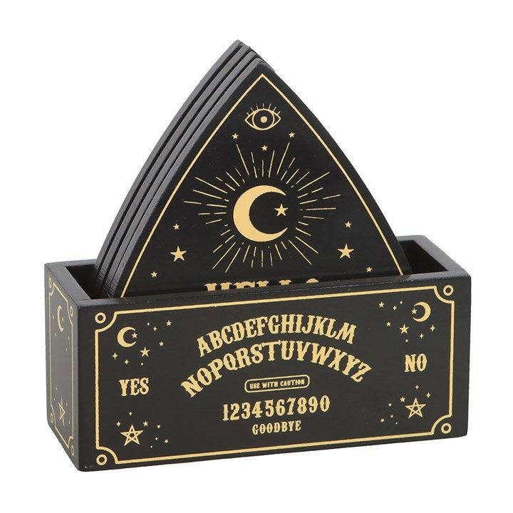 Set of 4 black and gold planchette-shaped coasters with celestial talking board design, complete with matching holder.