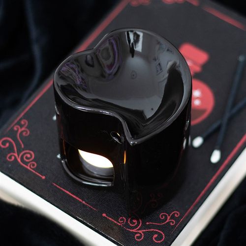 Black heart-shaped ceramic oil burner and wax warmer, perfect for creating a romantic ambiance.