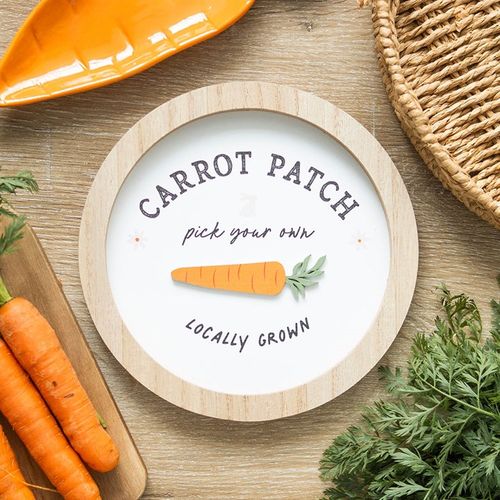 Round wall plaque with bunny and carrot design, perfect for home or garden decor