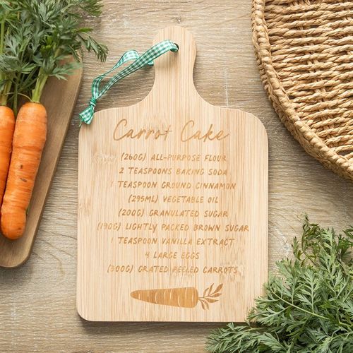 Wooden serving board with engraved carrot cake recipe, perfect for home bakers