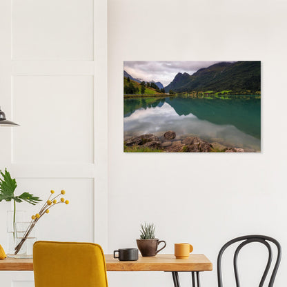 Artistic print showing the untouched beauty of Lake Floen with calm green waters and stoic mountains in the distance.