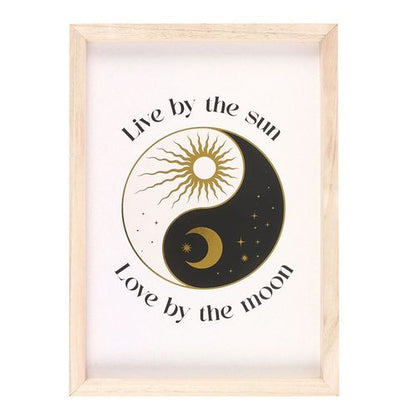 Framed celestial yin and yang print with "Live by the sun, love by the moon" text.