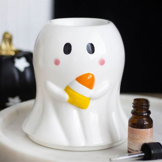 Ceramic ghost oil burner and wax warmer holding candy corn for Halloween décor