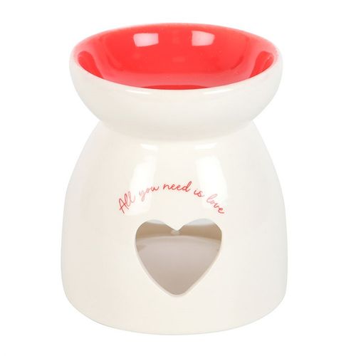 White ceramic oil burner with heart cut-out and "All you need is love" text, perfect for romantic and heartfelt gifting.