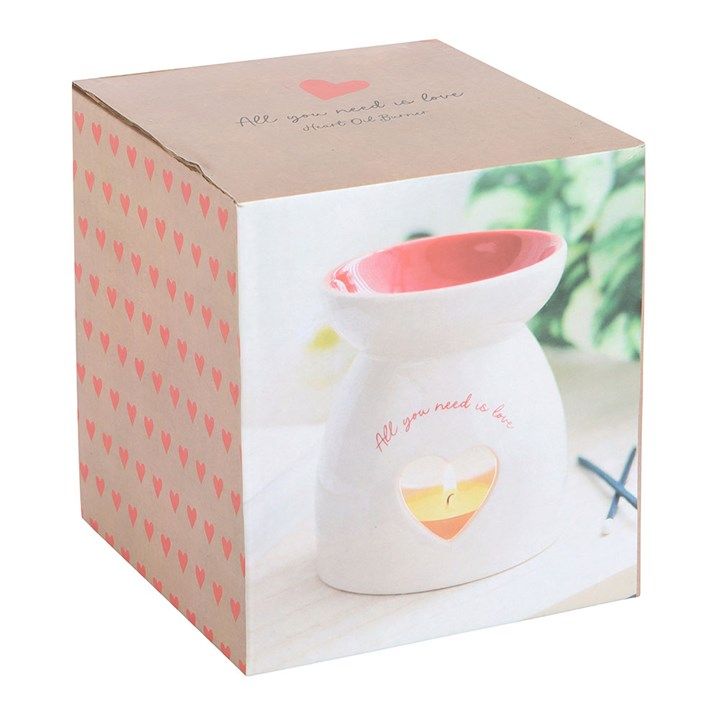 White ceramic oil burner with heart cut-out and "All you need is love" text, perfect for romantic and heartfelt gifting.