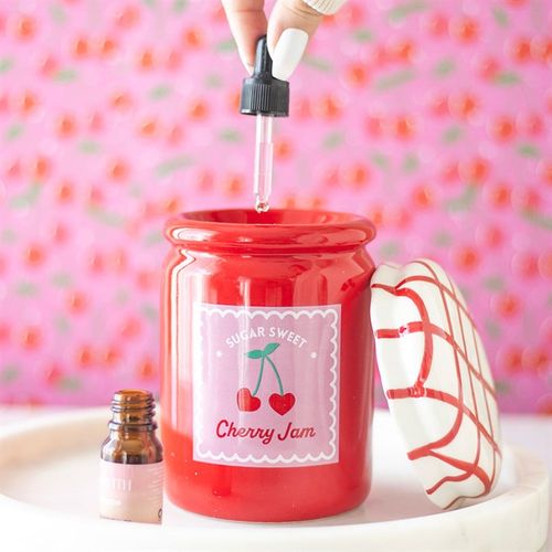 Cherry Red Jam Jar Ceramic Oil Burner with gingham lid, perfect for essential oils and wax melts.